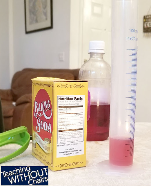 Space activities for kids can include science experiments like this one pictured. Image shows baking soda, vinegar, and a beaker. 