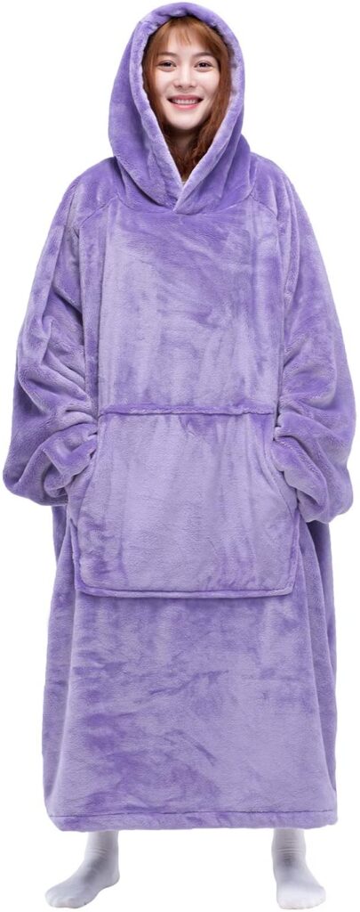 Woman in long, light purple wearable blanket