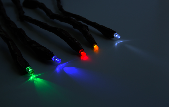 wands with lit tops of green, blue red and white for an electricity experiment