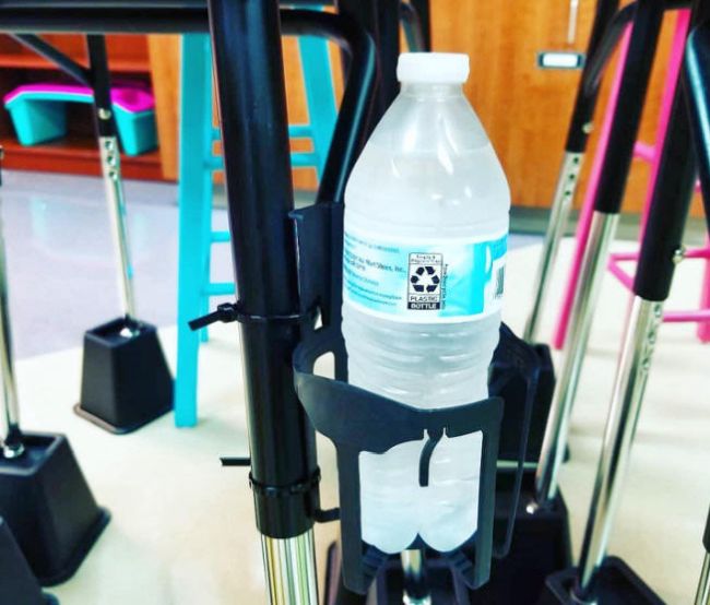 Car window drink holders like the ones shown repurposed as a water bottle holder for student desks by using zip ties