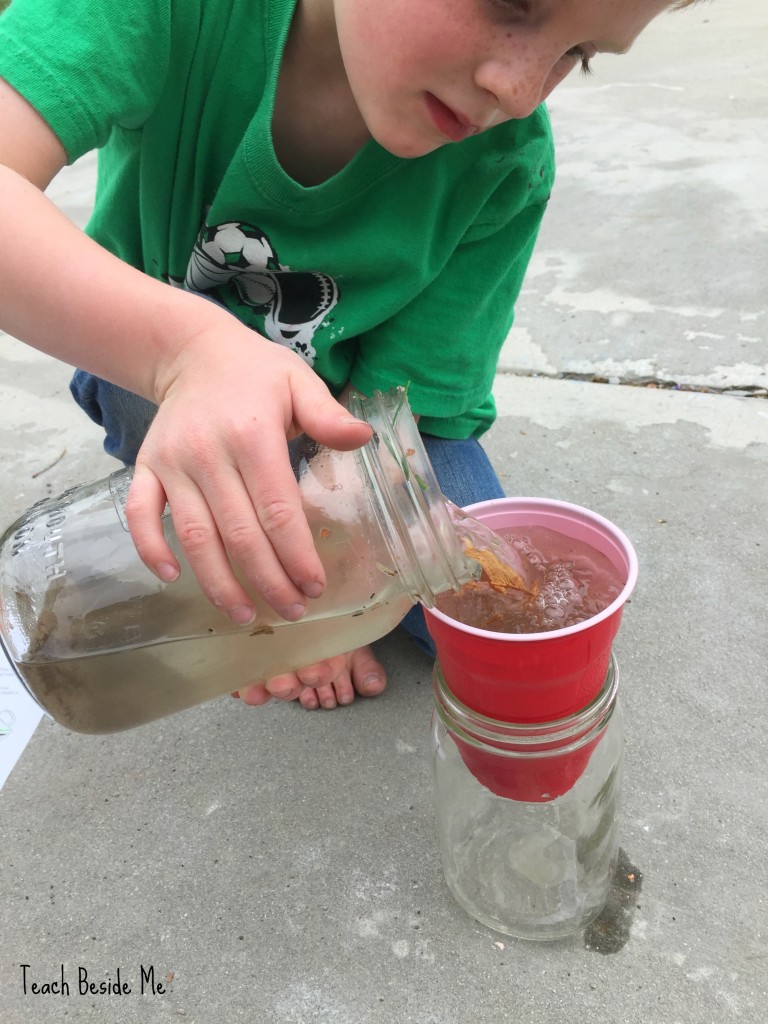 child pouring water into a cup filled with dirt for water activity about filtration 