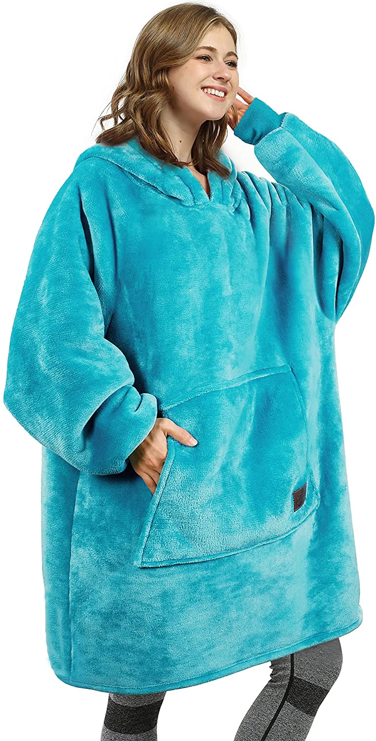 Woman in bright aqua wearable blanket