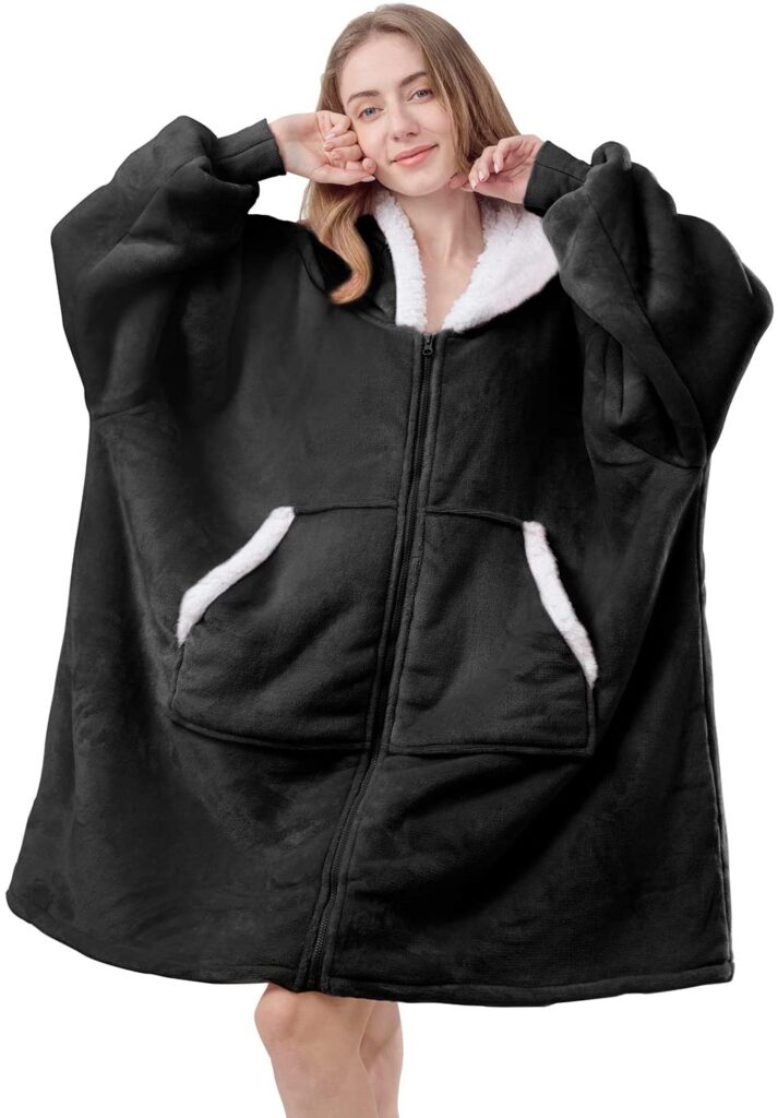 Woman in black wearable blanket with zipper