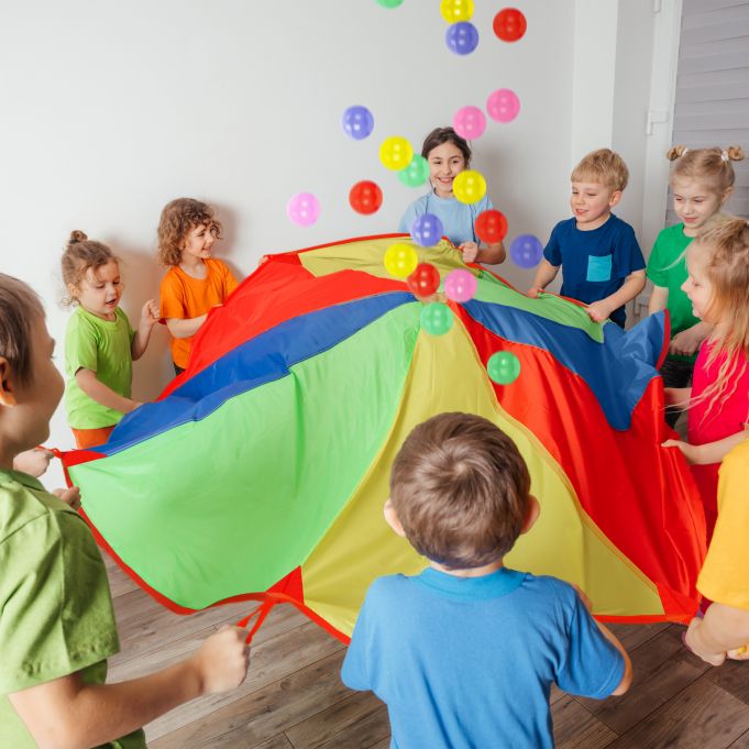 kids playing a parachute game 