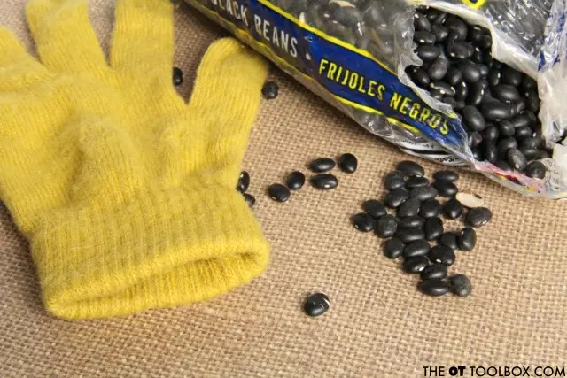 stretchy glove filled with beans for a DIY fidget toy 