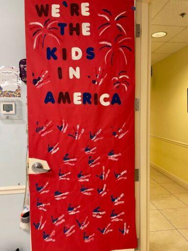 We're the kids in America red white and blue Fourth of July door decoration 