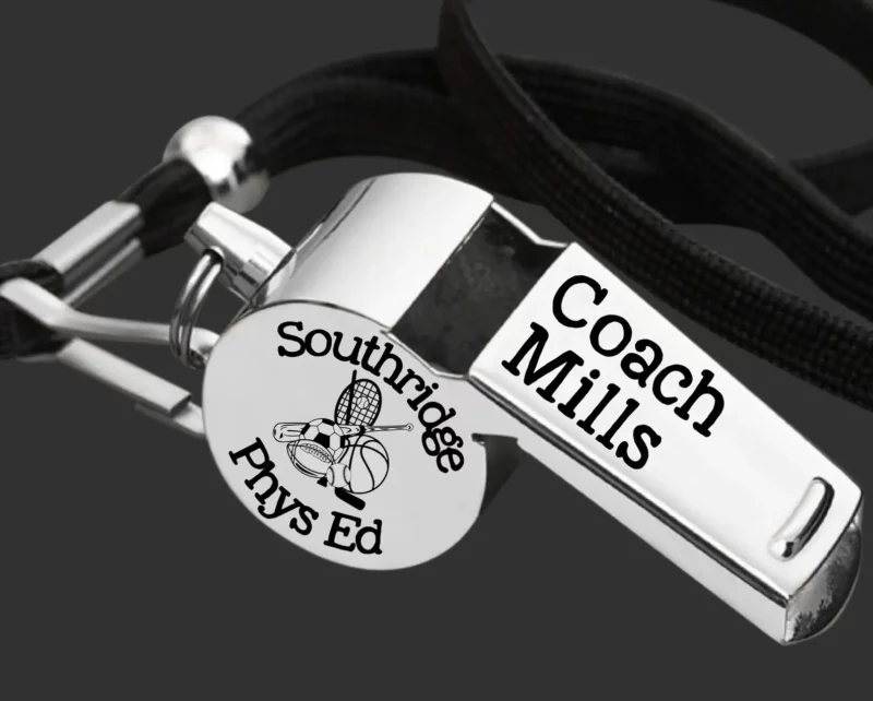 Stainless steel whistle engraved with "Coach Mills, Southridge Phs Ed"