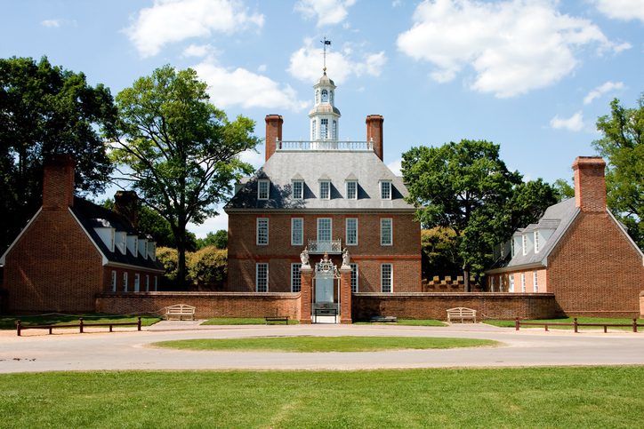 The Governor's Palace in Colonial Williamsburg, Virginia. A brick Colonial house with a courtyard, and former home of Thomas Jefferson.