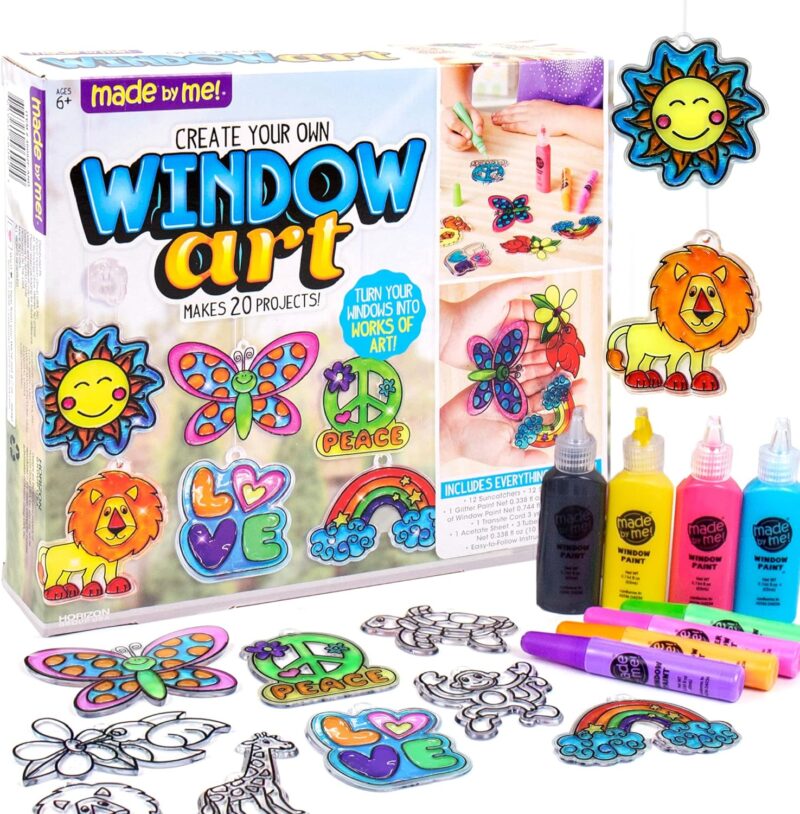 A box says Window Art and features plastic pieces in the shapes of butterflies, rainbows, etc. Paints are also shown.