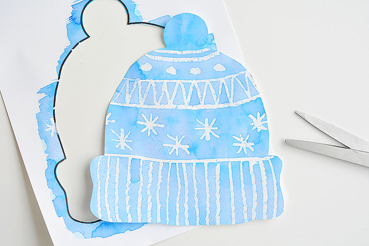 A colorful watercolor winter hat project as an example of classroom winter crafts 