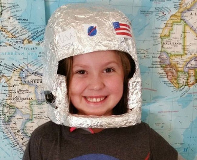 Girl wearing a DIY astronaut helmet