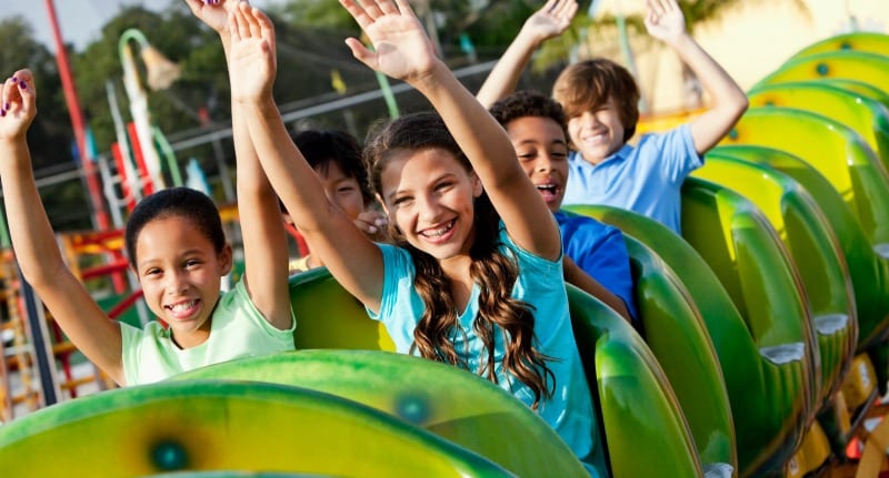 Children riding roller coaster