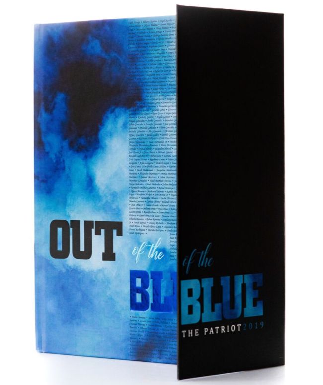 Yearbook produced by Entourage Yearbooks company, with a blue and black cover that reads Out of the Blue